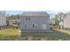 Spacious backyard with a concrete patio and well-maintained lawn, perfect for outdoor activities at 4655 Bluffton Ct, Cumming, GA 30028