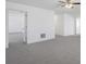 Carpeted bedroom featuring a ceiling fan and doorways to adjacent rooms at 4655 Bluffton Ct, Cumming, GA 30028