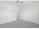 Carpeted bedroom featuring white walls and doors, with access to closet at 4655 Bluffton Ct, Cumming, GA 30028