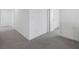 Hallway boasts gray carpeting and ample doorways for easy room access at 4655 Bluffton Ct, Cumming, GA 30028