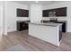 Beautiful kitchen with dark wood cabinets, granite countertops, stainless steel appliances, and an island at 4655 Bluffton Ct, Cumming, GA 30028