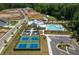 Aerial view of community amenities including a pool, tennis courts, and parking lot at 5325 Keepsake Court, Cumming, GA 30040