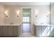 Luxurious bathroom with double vanity and glass shower enclosure at 5325 Keepsake Court, Cumming, GA 30040