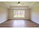 Comfortable bedroom with wood floors and tray ceiling at 5325 Keepsake Court, Cumming, GA 30040