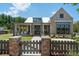 Charming home with brick accents, covered porch, and landscaped front yard with a walkway at 5325 Keepsake Court, Cumming, GA 30040
