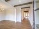 Bright living room features wood floors and exposed beam ceilings at 5325 Keepsake Court, Cumming, GA 30040