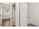 Bathroom with tile floor and an open door to a room with a window at 600 Silver Moon Dr, Loganville, GA 30052