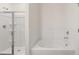Bathroom featuring a shower and a separate soaking tub at 600 Silver Moon Dr, Loganville, GA 30052