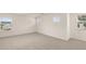 Spacious bedroom with carpeting and three windows offering plenty of natural light at 600 Silver Moon Dr, Loganville, GA 30052