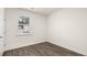 Bedroom with wood look floors, a window, white trim and baseboards at 600 Silver Moon Dr, Loganville, GA 30052