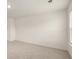 Bright bedroom with neutral carpet, white walls, and ample natural light from a large window at 600 Silver Moon Dr, Loganville, GA 30052
