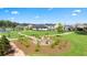 Community fire pit area with seating surrounded by trees and landscaped grounds at 600 Silver Moon Dr, Loganville, GA 30052
