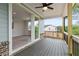 This covered back porch offers scenic views and features durable composite decking at 7515 Woolf Way, Cumming, GA 30028