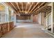 Spacious unfinished basement with insulated walls, natural light, and exterior access at 7515 Woolf Way, Cumming, GA 30028