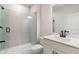 Contemporary bathroom featuring a glass shower, modern fixtures, and a sleek vanity with ample counter space at 7515 Woolf Way, Cumming, GA 30028