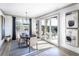 Sunlit dining room with views of the outdoor entertaining space, modern decor and sleek pendant lighting at 7515 Woolf Way, Cumming, GA 30028