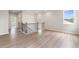 Spacious loft area with hardwood floors, natural light and a railing at 7515 Woolf Way, Cumming, GA 30028