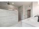 Modern main bathroom with a tiled shower, dual sinks, and neutral tones at 7515 Woolf Way, Cumming, GA 30028