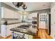 Bright, functional kitchen featuring granite countertops, stainless steel appliances, and ample counter space at 1872 Lake Lucerne Sw Dr, Lilburn, GA 30047