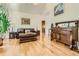 Spacious living area featuring hardwood floors, comfortable leather seating, and stylish decor at 1872 Lake Lucerne Sw Dr, Lilburn, GA 30047