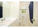 Bathroom with a single sink, mirror, and a toilet behind the door at 4080 Birch Bark Way, Douglasville, GA 30135