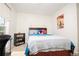 Bedroom with window, bookshelf, and bed with colorful decorations at 4080 Birch Bark Way, Douglasville, GA 30135