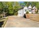 Spacious driveway leading to a two-car garage, adjacent to the side of this two-story home at 4080 Birch Bark Way, Douglasville, GA 30135
