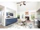 Open concept kitchen with stainless appliances, navy cabinets, wood-look floors, adjacent to dining area at 4080 Birch Bark Way, Douglasville, GA 30135