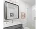 Modern bathroom featuring a glass-enclosed shower, white tile, and contemporary vanity at 5349 Memento Trace, Cumming, GA 30040