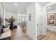 Bright foyer with staircase and views into living spaces at 5349 Memento Trace, Cumming, GA 30040