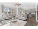 Spacious open-concept living room with hardwood floors and views to the kitchen and backyard at 545 Paces Dr, Lithia Springs, GA 30122