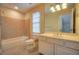 Bright bathroom with tiled walls, a shower/tub combo and a vanity with storage at 774 Piedmont Ne Ave # 11B, Atlanta, GA 30308