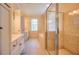 Large bathroom with a glass enclosed shower, jetted tub, and double sinks with lots of lighting at 774 Piedmont Ne Ave # 11B, Atlanta, GA 30308