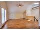 Expansive bonus room with hardwood flooring, neutral paint, and a cozy ceiling fan at 774 Piedmont Ne Ave # 11B, Atlanta, GA 30308
