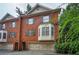 Well-maintained brick townhome with black shutters, bay window and attached garages at 774 Piedmont Ne Ave # 11B, Atlanta, GA 30308
