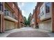 Charming brick townhomes with private garages and a brick courtyard create a desirable neighborhood setting at 774 Piedmont Ne Ave # 11B, Atlanta, GA 30308