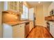 Galley style kitchen featuring updated stainless steel appliances and granite countertops at 774 Piedmont Ne Ave # 11B, Atlanta, GA 30308