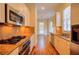 Modern kitchen with stainless steel appliances, granite countertops and hardwood flooring at 774 Piedmont Ne Ave # 11B, Atlanta, GA 30308