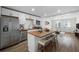 Bright eat-in kitchen featuring stainless steel appliances, white cabinets, and a butcher block island at 1024 Herndon Nw St, Atlanta, GA 30318