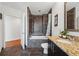 Stylish bathroom featuring tiled shower/tub, granite countertop vanity, and modern fixtures at 1080 Peachtree Ne St # 2416, Atlanta, GA 30309