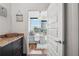 View of the primary bedroom highlighting the city skyline and wood floors at 1080 Peachtree Ne St # 2416, Atlanta, GA 30309