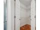 Walk-in closet with wire shelving and hardwood floors at 1080 Peachtree Ne St # 2416, Atlanta, GA 30309