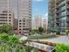 Beautiful courtyard with a water feature, lush landscaping, and comfortable seating areas at 1080 Peachtree Ne St # 2416, Atlanta, GA 30309