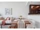 Dining area with modern table setting, comfortable seating, and stylish decor next to the living room at 1080 Peachtree Ne St # 2416, Atlanta, GA 30309