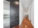 Long hallway with hardwood floors, storage, and recessed lighting leading to other rooms at 1080 Peachtree Ne St # 2416, Atlanta, GA 30309