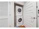 Stacked washer and dryer are neatly tucked away in the laundry closet at 1080 Peachtree Ne St # 2416, Atlanta, GA 30309