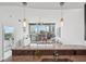Open-concept living room with city views, a modern chandelier, and stylish decor at 1080 Peachtree Ne St # 2416, Atlanta, GA 30309