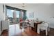 Sun-drenched living room featuring hardwood floors, city views, and modern furnishings at 1080 Peachtree Ne St # 2416, Atlanta, GA 30309