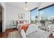 Serene main bedroom with city views, comfortable bed, and chic modern decor at 1080 Peachtree Ne St # 2416, Atlanta, GA 30309