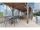 Outdoor kitchen with a grill, bar seating, and covered pergola, creating a perfect entertainment space at 1080 Peachtree Ne St # 2416, Atlanta, GA 30309